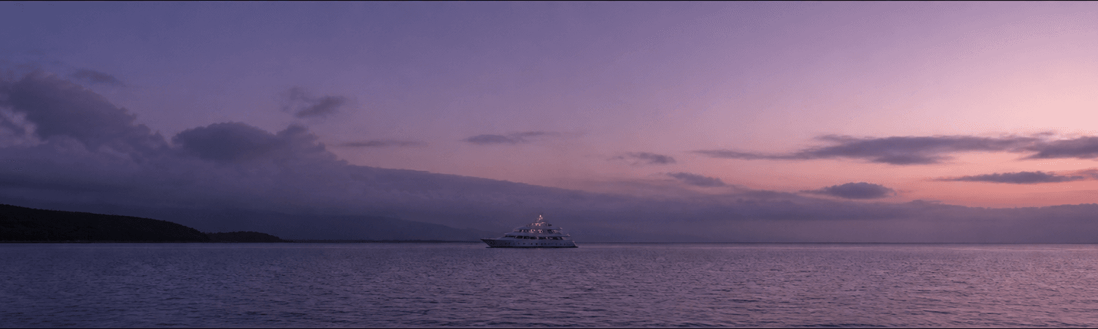 Yacht underway at dusk
